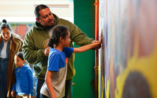 Lawrence community members leave their marks as part of Vermont Street garage mural